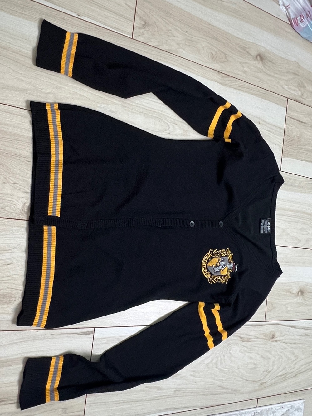 Warner Bros. Harry Potter Black Sweater with Gold Crest Accent